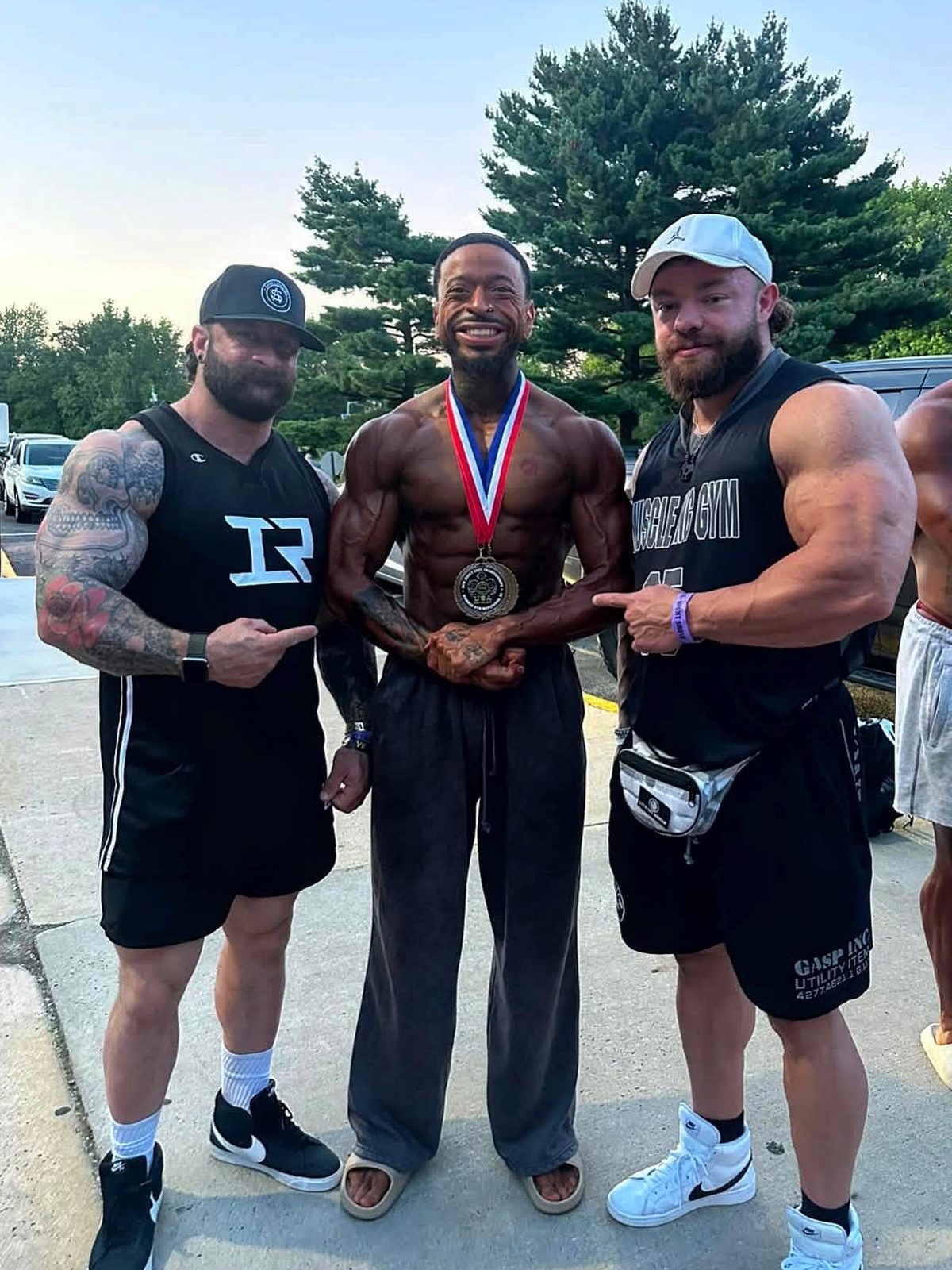 MVP coach with a client after a bodybuilding show