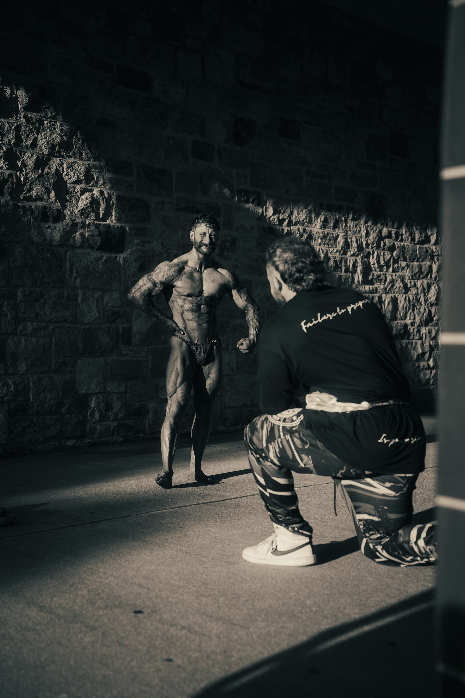 MVP coach reviewing posing with a competing athlete