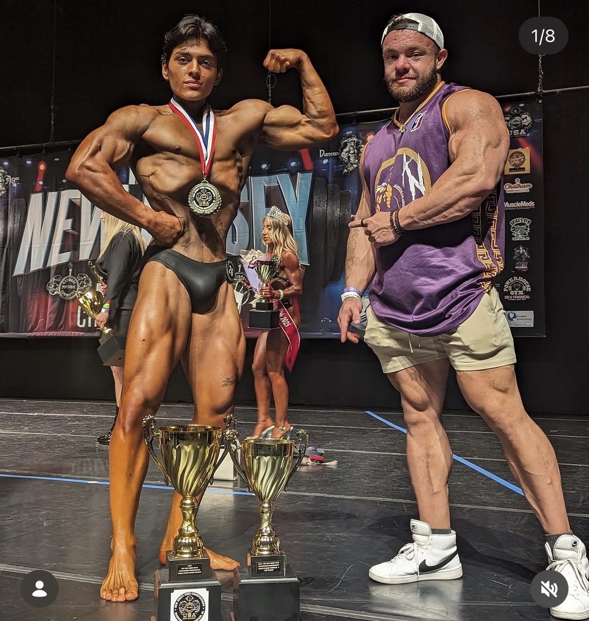 MVP athlete on stage with competition trophies